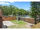 Fenced backyard with small storage shed, grass and concrete patio area at 6809 Magnolia Pointe Cir, Orlando, FL 32810