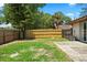 Fenced backyard with grassy area and patio area at 6809 Magnolia Pointe Cir, Orlando, FL 32810