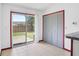 Exterior sliding glass door leading to a grassy backyard with a wood fence at 6809 Magnolia Pointe Cir, Orlando, FL 32810