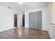 Large bedroom with wood floors, a window, closet and bright lighting at 6809 Magnolia Pointe Cir, Orlando, FL 32810