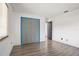 Bedroom with wood floors, a window and large closet behind bi-fold doors at 6809 Magnolia Pointe Cir, Orlando, FL 32810