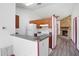 Kitchen featuring a white refrigerator, wood cabinets, and open bar area at 6809 Magnolia Pointe Cir, Orlando, FL 32810