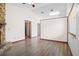 Bright, open living room with a stone fireplace, ceiling fan, and wood-look floors at 6809 Magnolia Pointe Cir, Orlando, FL 32810
