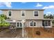 A backyard features a patio with seating, a pergola, and mulch ground covering at 7642 Park Hill Ave, Leesburg, FL 34748
