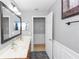 An updated bathroom offers an extended double sink vanity with a large mirror, and shower-tub combination at 7642 Park Hill Ave, Leesburg, FL 34748