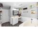 Bathroom features a soaking tub, vanity area, and ample storage, offering a relaxing retreat at 7642 Park Hill Ave, Leesburg, FL 34748