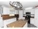Spacious kitchen with an island, stainless steel appliances, and ample cabinet space at 7642 Park Hill Ave, Leesburg, FL 34748