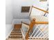 Carpeted staircase with white railing and wooden banister, offering a smooth transition to the upper floor at 7642 Park Hill Ave, Leesburg, FL 34748