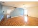 Spacious living area with staircase, stylish wood-look tile flooring and natural light pouring through the windows at 8330 Lainie Ln, Orlando, FL 32818