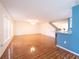 Bright and airy living area showcasing wood-look tile flooring, neutral walls, and an open layout at 8330 Lainie Ln, Orlando, FL 32818