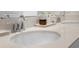 Bathroom sink featuring chrome faucet, quartz countertop, and decorative accessories at 884 Laurel View Way, Groveland, FL 34736