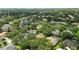 Panoramic aerial of homes in leafy suburb; clear skies in background at 9491 Wickham Way, Orlando, FL 32836