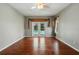Spacious bedroom with hardwood floors and access to the pool area at 9491 Wickham Way, Orlando, FL 32836