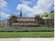 Attractive stone entrance sign for Bristol Park community, framed by landscaping and lush green lawns at 9491 Wickham Way, Orlando, FL 32836