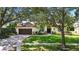 Inviting single-story home with well-maintained landscaping, a two-car garage, and a neatly manicured lawn at 9491 Wickham Way, Orlando, FL 32836