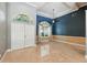 Foyer featuring high ceilings, a large arched window, and marble floors at 9491 Wickham Way, Orlando, FL 32836