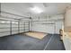 Spacious garage with ample storage, organization racks, and updated white cabinets at 9491 Wickham Way, Orlando, FL 32836