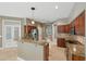 Open kitchen with granite countertops, stainless steel appliances and a breakfast bar at 9491 Wickham Way, Orlando, FL 32836