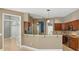 Open kitchen with granite countertops, stainless steel appliances, and ample counter space at 9491 Wickham Way, Orlando, FL 32836