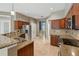 Kitchen featuring granite countertops, stainless steel appliances, and a stone backsplash at 9491 Wickham Way, Orlando, FL 32836