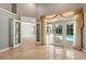 Spacious living room with French doors leading to the outdoor pool area for seamless indoor/outdoor living at 9491 Wickham Way, Orlando, FL 32836