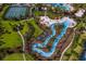 Resort-style community with a lazy river, tennis courts, and lush landscaping at 4111 Oaktree Dr, Davenport, FL 33837