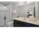 Bright bathroom with a glass-enclosed shower and white countertop at 4111 Oaktree Dr, Davenport, FL 33837