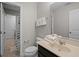 Bright bathroom with a vanity, toilet, and a shower/tub combo at 4111 Oaktree Dr, Davenport, FL 33837