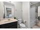 Bathroom featuring a tub/shower combo, black vanity, and neutral paint color at 4111 Oaktree Dr, Davenport, FL 33837
