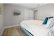 Cozy bedroom with laminate floors and a wall-mounted television at 4111 Oaktree Dr, Davenport, FL 33837