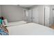Bedroom featuring two twin beds, neutral walls, and entryways at 4111 Oaktree Dr, Davenport, FL 33837