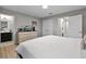 Bedroom featuring a dresser with television, two closets, and wood floors at 4111 Oaktree Dr, Davenport, FL 33837
