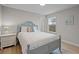 Charming bedroom with a light blue bed frame and hardwood floors at 4111 Oaktree Dr, Davenport, FL 33837