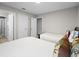 Bedroom featuring two twin beds, neutral walls, and multiple entryways at 4111 Oaktree Dr, Davenport, FL 33837