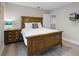 Nicely appointed bedroom with wood furniture and laminate flooring at 4111 Oaktree Dr, Davenport, FL 33837