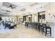 Stylish lounge area with ample seating, TV, bar, and contemporary design for social gatherings at 4111 Oaktree Dr, Davenport, FL 33837
