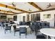 Outdoor seating area with tables, chairs, ceiling fans, and a TV for relaxing and socializing at 4111 Oaktree Dr, Davenport, FL 33837