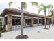 Community poolside bar and restaurant offering seating, roll up window and tiled roof at 4111 Oaktree Dr, Davenport, FL 33837