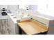 Bright laundry room featuring multiple washers, dryers, and a folding table at 1000 S Semoran Blvd # 415, Winter Park, FL 32792