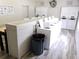 Bright laundry room with multiple washers and dryers and folding counter for convenience at 1000 S Semoran Blvd # 415, Winter Park, FL 32792