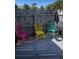 Cozy patio area with colorful chairs and a barbecue grill at 1000 S Semoran Blvd # 415, Winter Park, FL 32792