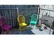 Outdoor space featuring a grill and multiple colorful chairs against a wooden fence at 1000 S Semoran Blvd # 415, Winter Park, FL 32792