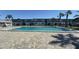 Community pool with brick pavers and palm trees, perfect for relaxation and recreation at 1000 S Semoran Blvd # 415, Winter Park, FL 32792