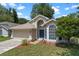 Attractive single-Gathering home with manicured lawn and mulched flower beds leading to the front entrance at 1021 Piedmont Oaks Dr, Apopka, FL 32703
