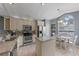 Well-lit kitchen featuring stainless steel appliances, granite countertops, and a cozy breakfast nook at 1021 Piedmont Oaks Dr, Apopka, FL 32703