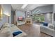 Cozy living room featuring a fireplace, skylight, and sliding glass doors leading to outdoor space at 1021 Piedmont Oaks Dr, Apopka, FL 32703