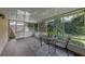 The screened patio has an outdoor table with two chairs at 1021 Piedmont Oaks Dr, Apopka, FL 32703