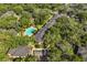 Aerial view of the property showcasing lush trees, pool, and well-maintained building exteriors at 1055 Kensington Park Dr # 203, Altamonte Springs, FL 32714