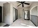 View of the covered tiled balcony featuring black railing and ceiling fan at 1055 Kensington Park Dr # 203, Altamonte Springs, FL 32714