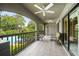 Spacious tiled balcony with ceiling fans, seating, and a view of the community pool at 1055 Kensington Park Dr # 203, Altamonte Springs, FL 32714